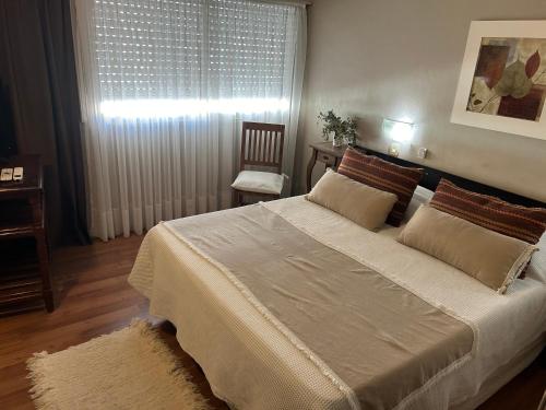Ένα ή περισσότερα κρεβάτια σε δωμάτιο στο Hotel Rio