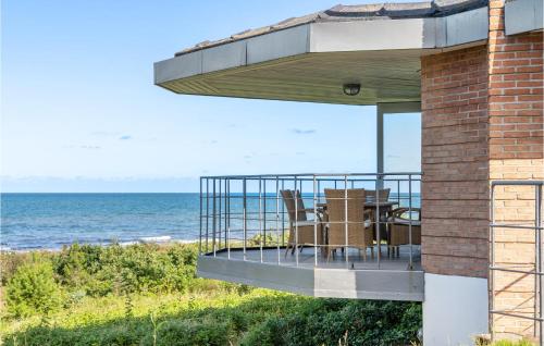 a house with a balcony overlooking the ocean at 6 Bedroom Gorgeous Home In Gilleleje in Gilleleje