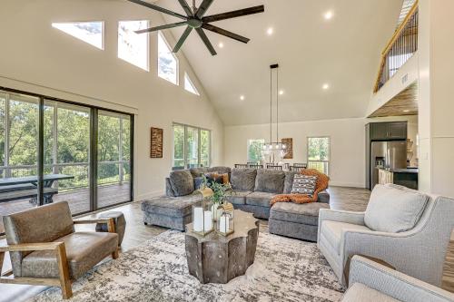 a large living room with a vaulted ceiling at Riverfront Murfreesboro Cabin with Fire Pit in Nashville