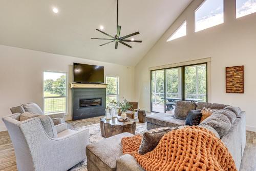 a living room with two couches and a tv at Riverfront Murfreesboro Cabin with Fire Pit in Nashville
