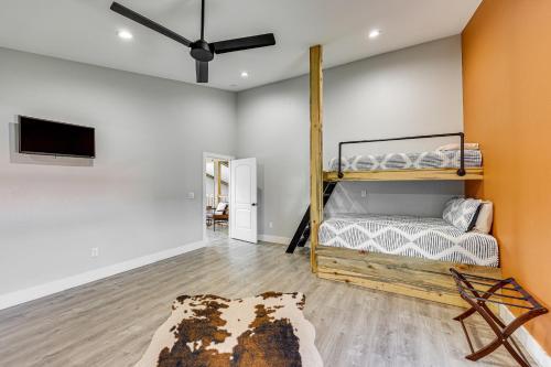 a bedroom with a bunk bed and a tv at Family Tradition Glenwood Cabin with River Access! in Glenwood
