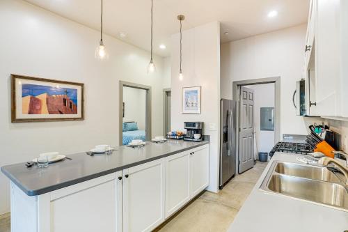 a kitchen with white cabinets and a sink at Tucson Vacation Rental Near Downtown and University! in Tucson