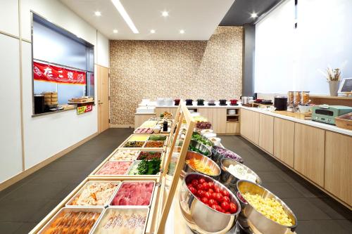 a buffet line with many different types of food at Karaksa Hotel Osaka Namba in Osaka