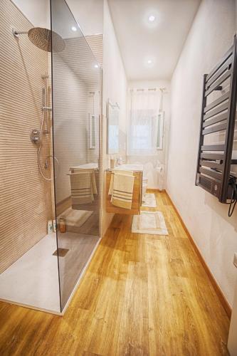 a bathroom with a shower and a glass shower stall at 5 Minuti dalla Spiaggia - La Casa di Kiki in Oristano
