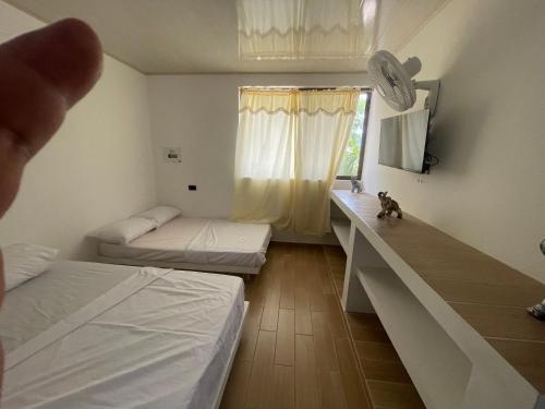 Katil atau katil-katil dalam bilik di Eco Hotel Campestre Atlantis San Joaquín La Mesa