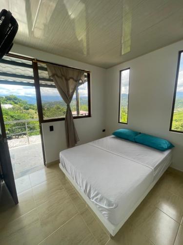 Katil atau katil-katil dalam bilik di Eco Hotel Campestre Atlantis San Joaquín La Mesa