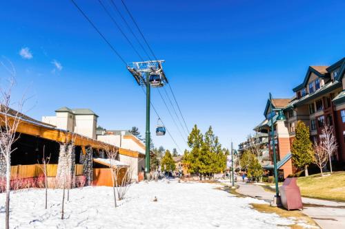 a snowy street in a city with a ski lift at Hotel Becket, BW Signature Collection in South Lake Tahoe