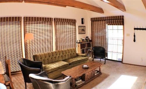 a living room with a couch and a table at A Frame of Mind in Red River