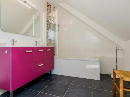 a bathroom with a purple cabinet and a bath tub at Maison neuve au calme avec jardin clos, proche plage, port et équipements familiaux - FR-1-306-1274 in La Turballe