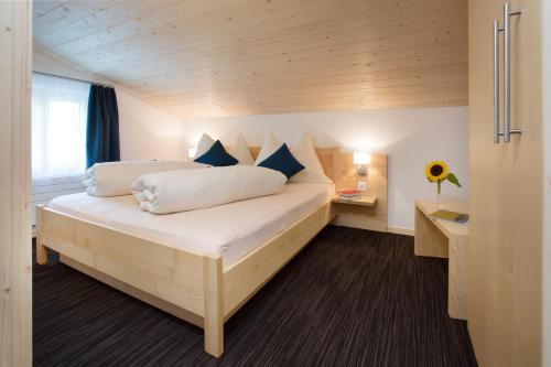 Postel nebo postele na pokoji v ubytování Boutique-Hotel Vincenz