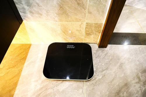a cell phone is sitting on the floor at Castle Bayview Resort & Spa in Kampot