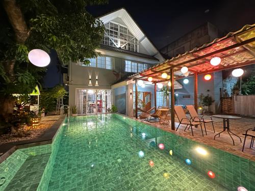 a swimming pool with balls in the water at Comfy Boutique House in Chiang Mai