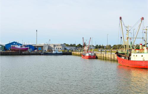 a group of boats docked in a body of water at Holiday Home Romo With Sea View 154 in Bolilmark