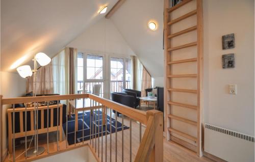 a stairway leading to a room with a living room at Holiday Home Romo With Sea View 154 in Bolilmark