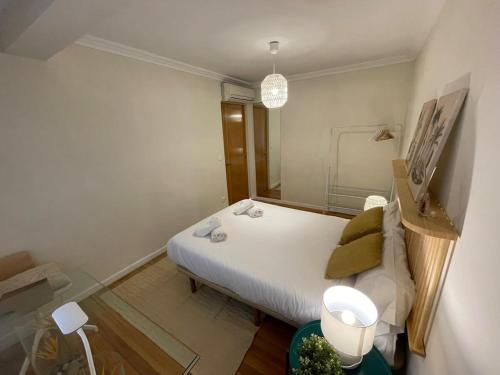 Кровать или кровати в номере Coqueto apartamento en el centro de Santander