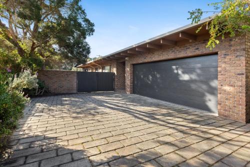 a garage door on a brick house at Brooks by the bay in Blairgowrie