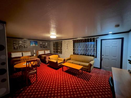 a living room with two beds and a couch at Cascade Lodge - Central Bend Retreat in Bend