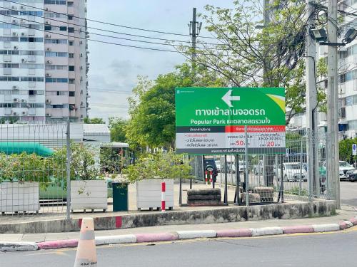 a sign that is on the side of a street at Impact Arena C3 Milo in Nonthaburi