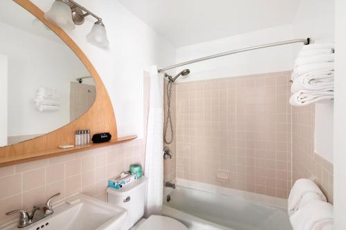 a bathroom with a sink and a toilet and a mirror at The Atlantic in Southampton