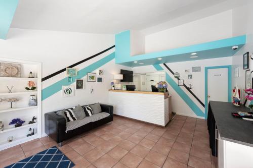 a living room with a couch and a staircase at The Atlantic in Southampton
