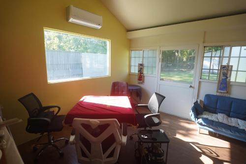 a room with a table and chairs and a couch at Chill Life B&B in Jian
