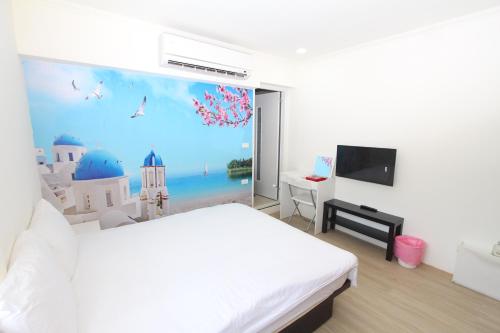a bedroom with a white bed and a large window at Sea Keelung in Keelung