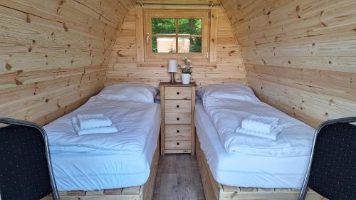 Postel nebo postele na pokoji v ubytování 38 Mini Pod "Arlau"