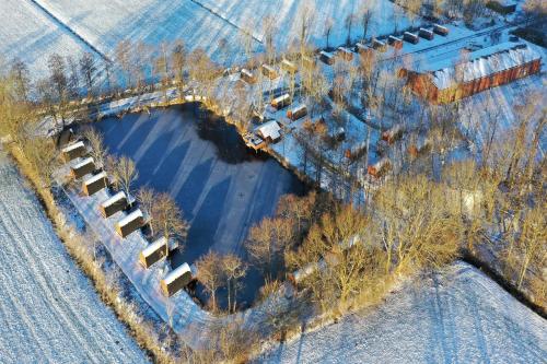 an overhead view of a train yard with cars parked at 12 Premium Camping Pod "Fehmarn" in Silberstedt