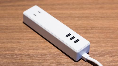 a nintendo wii remote on a wooden table at JR East Hotel Mets Premier Akihabara in Tokyo