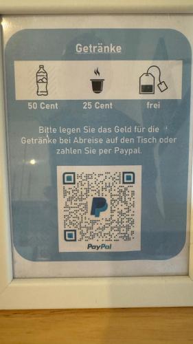 a sign in a bathroom with a sign for a soap dispenser at Apartment Erfurt-Marbach in Erfurt