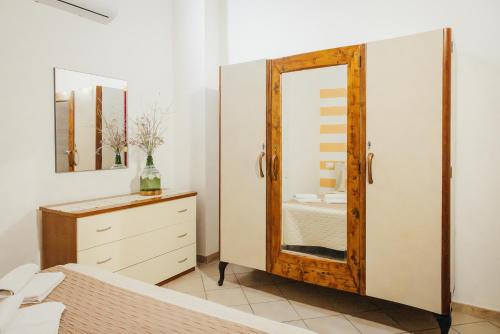 Ένα ή περισσότερα κρεβάτια σε δωμάτιο στο Casa Romano