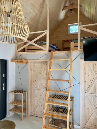 a room with bunk beds and a chandelier at H&Z Radawa in Radawa