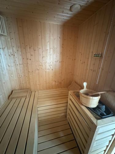 a wooden sauna with a bowl on top of it at Villa RELAX Miševići in Sarajevo
