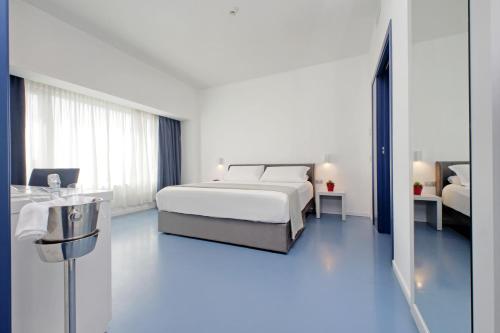Cama o camas de una habitación en Hotel Poseidon