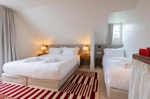 Postel nebo postele na pokoji v ubytování Hotel Villa Bonnie