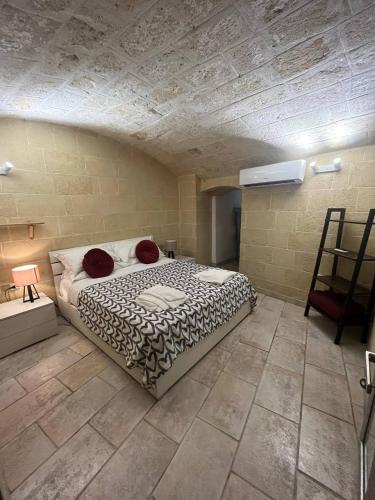 a bedroom with a bed in a room at Perla Marina in Monopoli