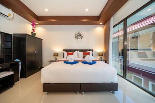 Postel nebo postele na pokoji v ubytování Boutique Resort Private Pool Villa - SHA Extra Plus