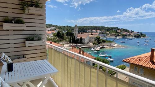 a balcony with a view of a body of water at Up&Above ,New Luxury Apt, Steps from Beach and Old Town in Hvar