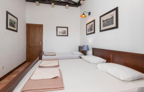 Ένα ή περισσότερα κρεβάτια σε δωμάτιο στο Ilic Apartmani