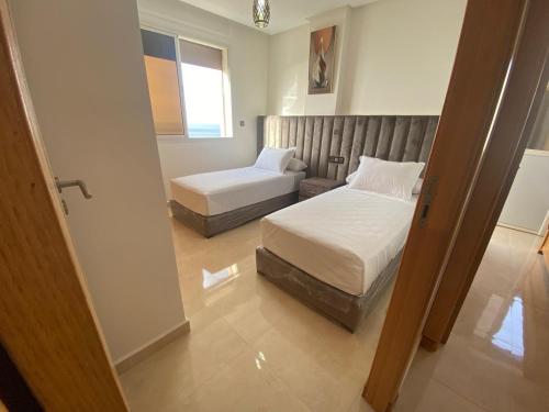 Postel nebo postele na pokoji v ubytování Apartment Familiale Al-Hoceima, Vue sur mer