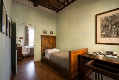 Postel nebo postele na pokoji v ubytování Al Porto Di Lucca B&B