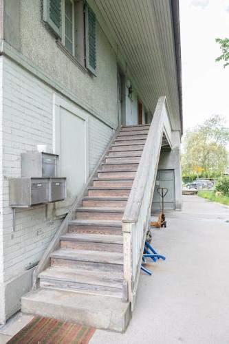 a staircase leading up to a building with a door at BnB Ilfis Wohnung Nr 1 in Langnau