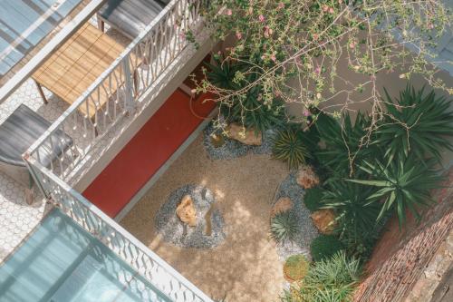 an overhead view of a balcony with plants at 365.Hostel in Tainan