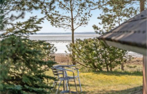 a view of the beach from the window of a house at Holiday Home Nordbakken Havndal Xii in Sødring