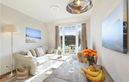 a living room with a table with bananas on it at Baltischer Hof Apartment 48 in Boltenhagen