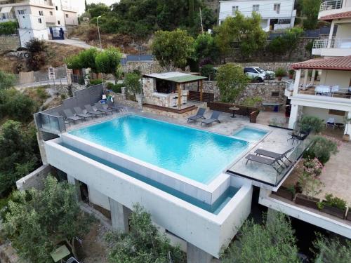 an overhead view of a swimming pool in a house at Royal 1967 in Himare