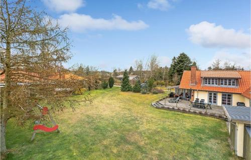an aerial view of a house with a yard at 3 Bedroom Gorgeous Home In Højslev in Højslev
