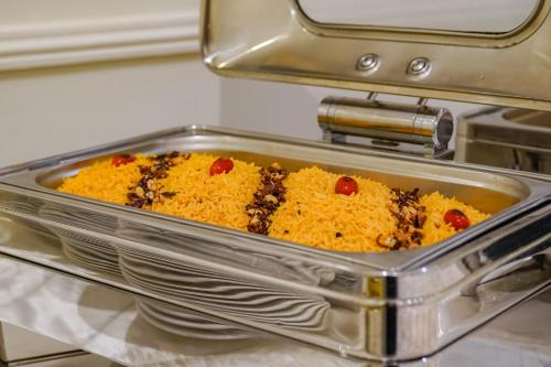 a casserole dish of food in an oven at Emaar Al Manar in Makkah
