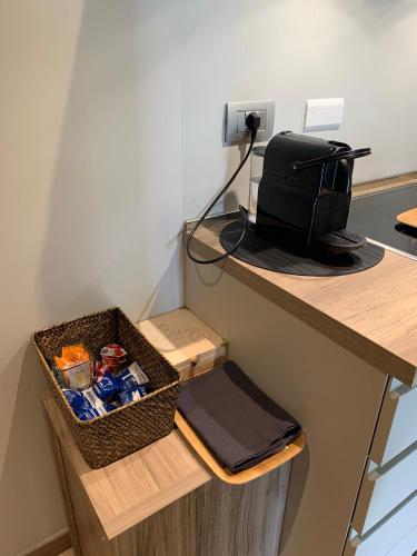 a desk with a box of food and a bag on it at GreenValley BnB in Lapedona