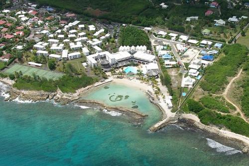 an aerial view of a resort near the ocean at La vida krys in Saint-François